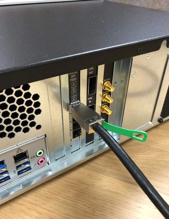 Mini-SAS HD digital output cable connected to the digital output pods on the rear panel of the Model 686-4C.